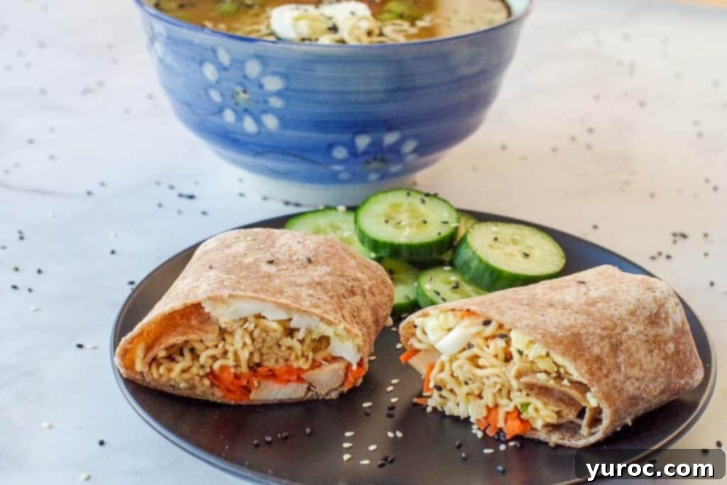 Ramen Roll 2 Ramen wrap on a black plate with cucumbers and ramen soup in the background.