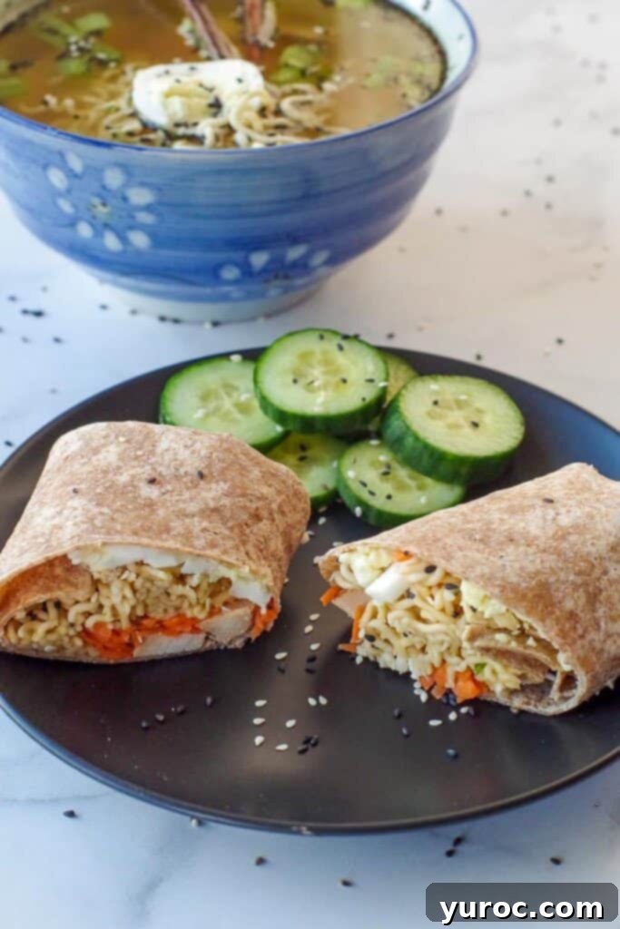 Ramen Roll 7 Ramen wrap on a black plate with cucumbers and ramen soup in the background.