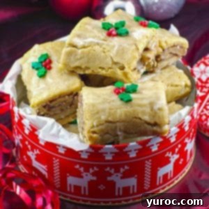 Gingerbread Yule log cookies in a red and white Christmas cookie tin