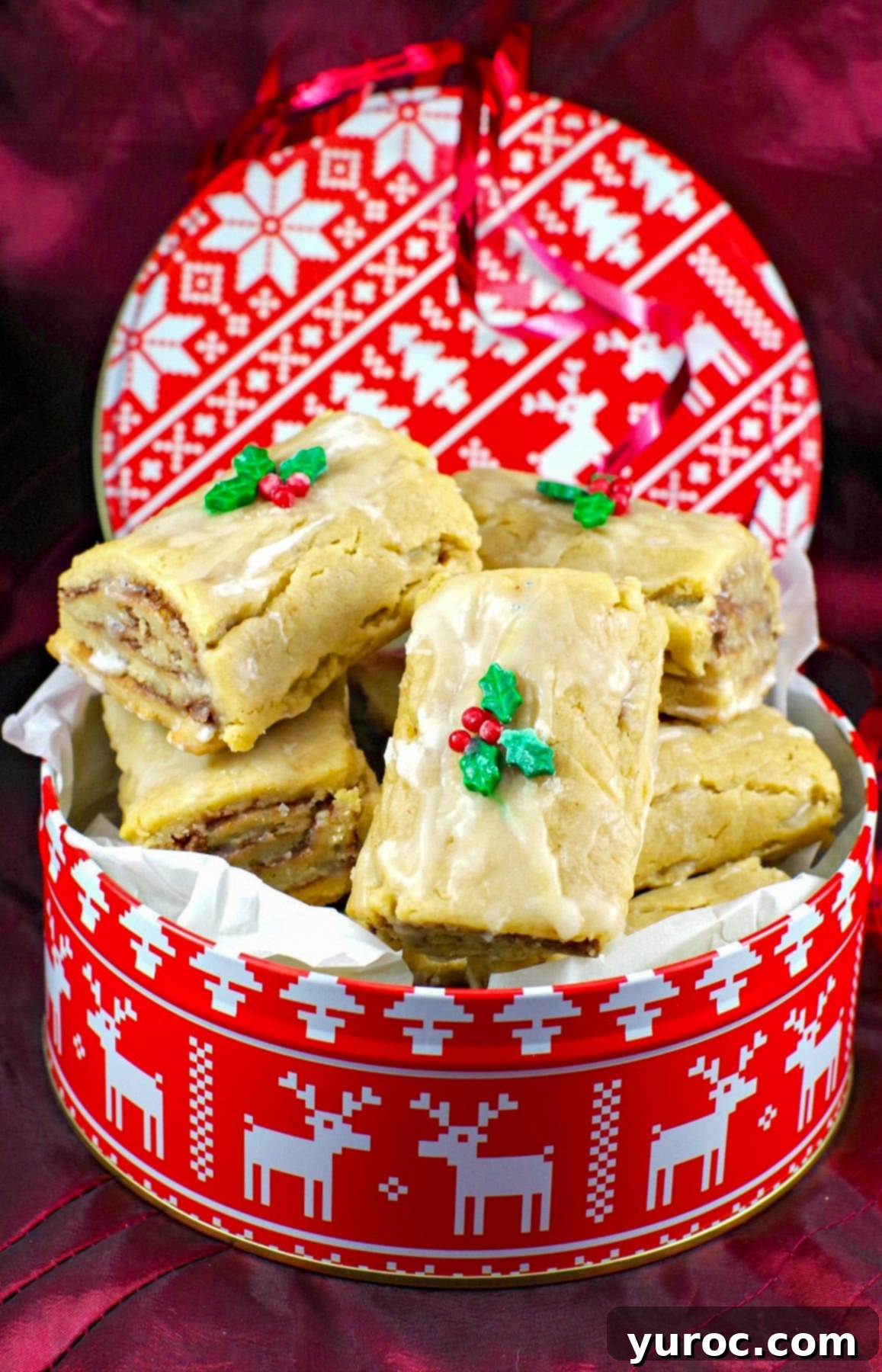 soft Gingerbread Yule log cookies in a red and white Christmas cookie tin