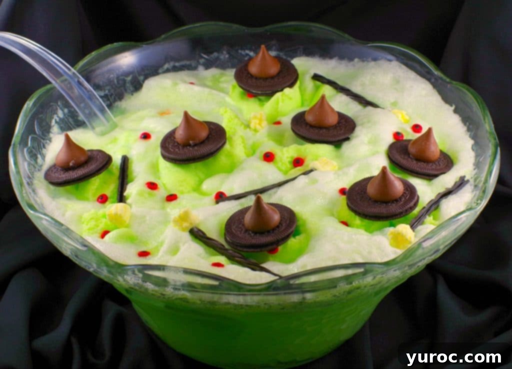 Mystic Cauldron Cocoa 4 Melting witch green Halloween punch with chocolate hats, licorice marshmallow brooms and candy eyes
