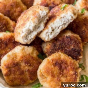 Ukrainian Kotleti Pork Pattis piled on top of each other with one cut in half
