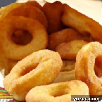 Ukrainian style donuts (pampushky) in a paper bag on Ukrainian patterned tablecloth