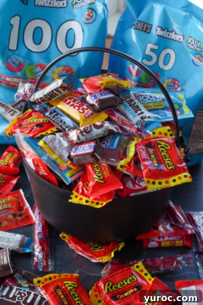 Halloween Candy Remix Tarts 3 Leftover Halloween Candy in a black plastic cauldron with bags of candy in the background