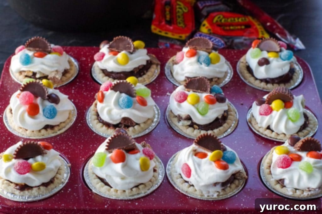 Halloween Candy Remix Tarts 8 leftover Halloween candy tarts in a red muffin tin