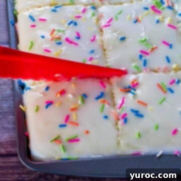 Sugar cookie sheet pan pancakes being cut into with a nylon knife