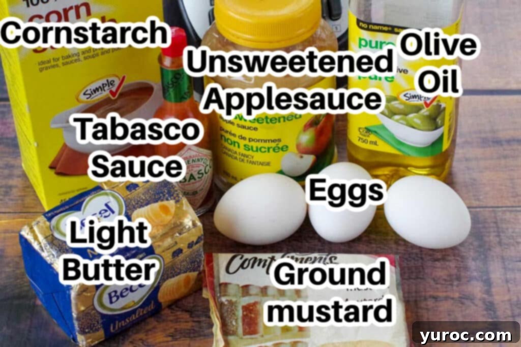 Lighter Hollandaise 3 eggs, butter, applesauce, olive oil, dry mustard, cornstarch, Tabasco sauce on wooden surface
