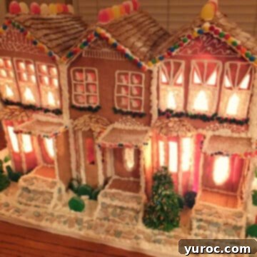 An impressive, large gingerbread house condominium, intricately decorated for the holidays.