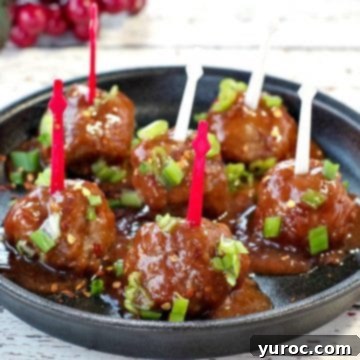 Close-up of Slow Cooker Turkey Meatballs simmering in a rich cranberry sauce, ready to be served.