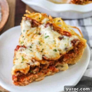 spaghetti pie on a white plate
