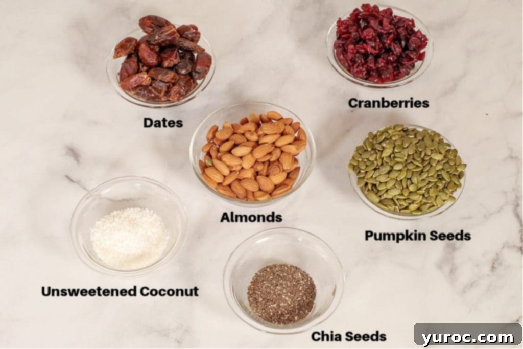 ingredients in healthy homemade energy bars, labelled, in small glass bowls