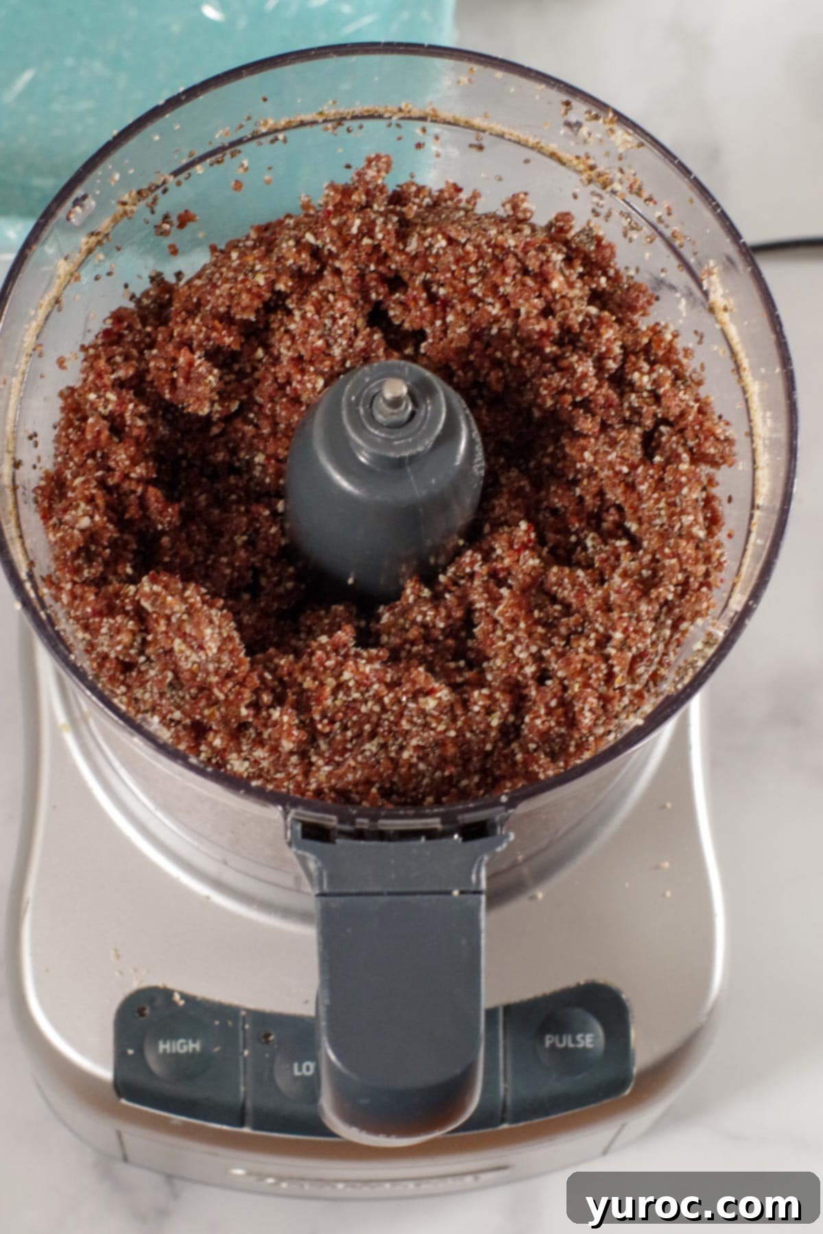 ingredients for energy bars ground together in food processor