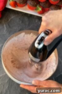 all ingredients being whipped with electric hand mixer