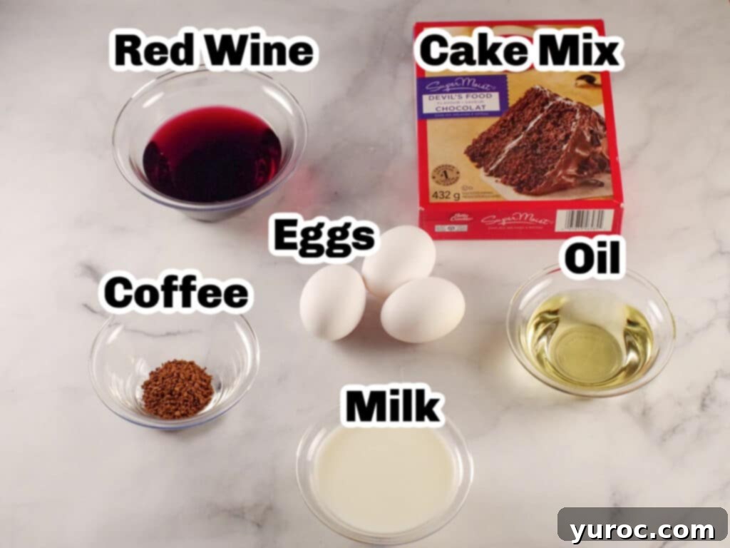 Effortless Elegance Red Wine Chocolate Cupcakes 3 Labeled ingredients for chocolate red wine cupcakes, including a box cake mix, red wine, milk, eggs, instant coffee granules, and vegetable oil.