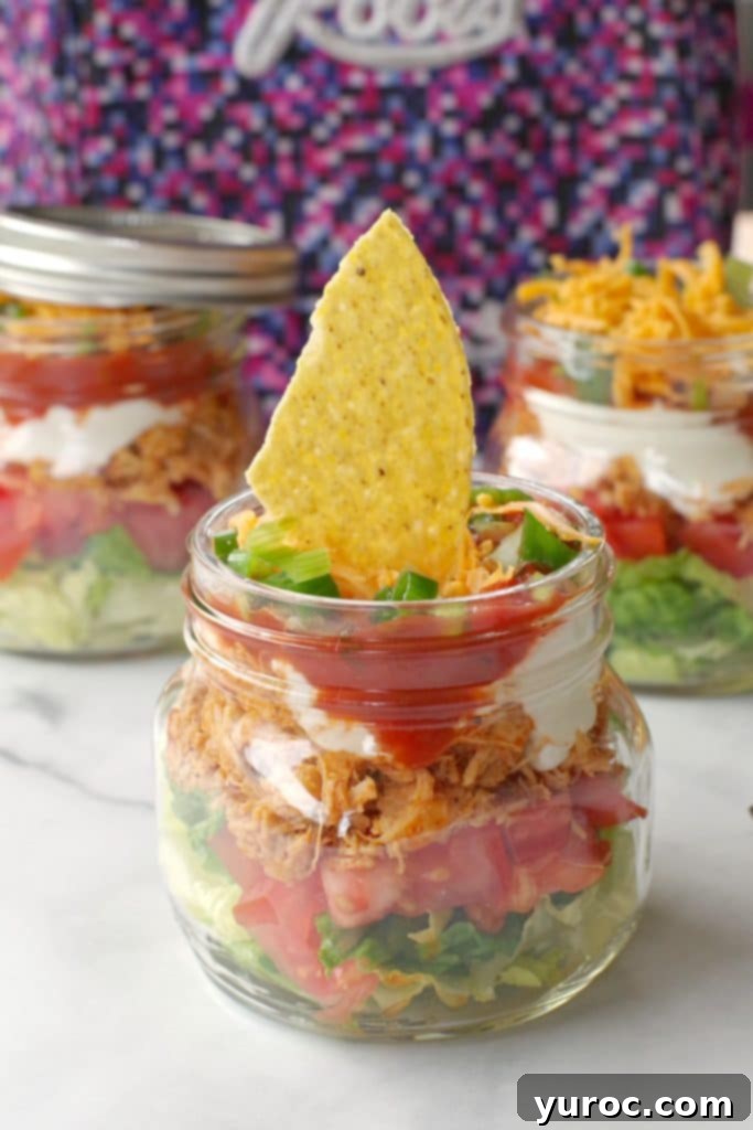 45 Effortless Tips for Boosting Your Produce Intake 8 mason jar taco salad with more jars and lunchbag in background