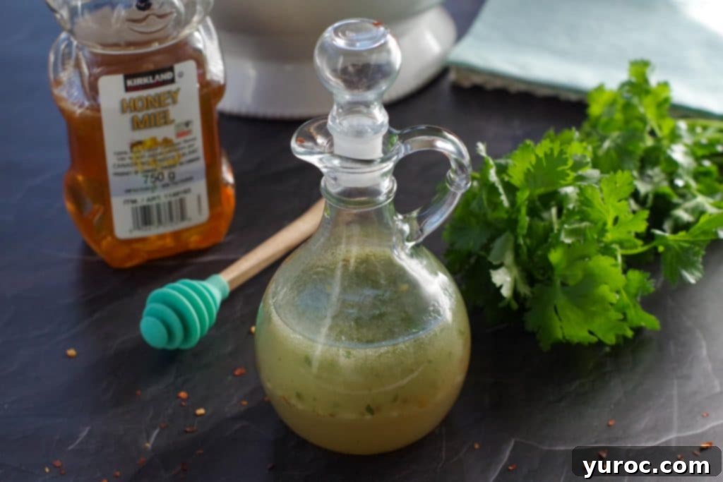 Fiery Cajun Mango Chicken Salad 9 bottle of honey lime cilantro dressing with bottle of honey and fresh cilantro