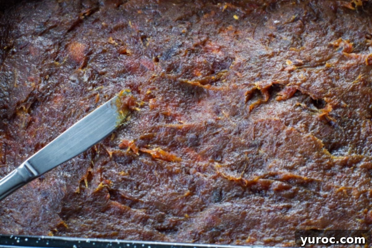 date filling being spread with a butter knife