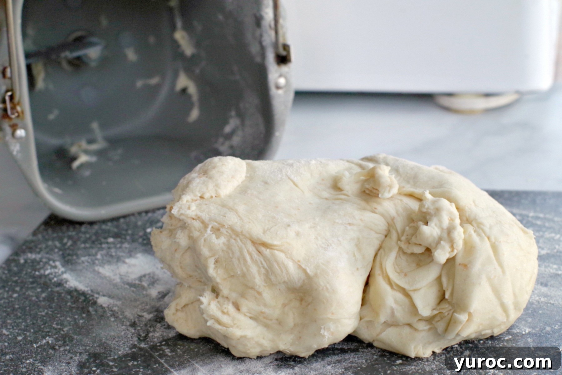 bread machine pizza dough on a cutting board