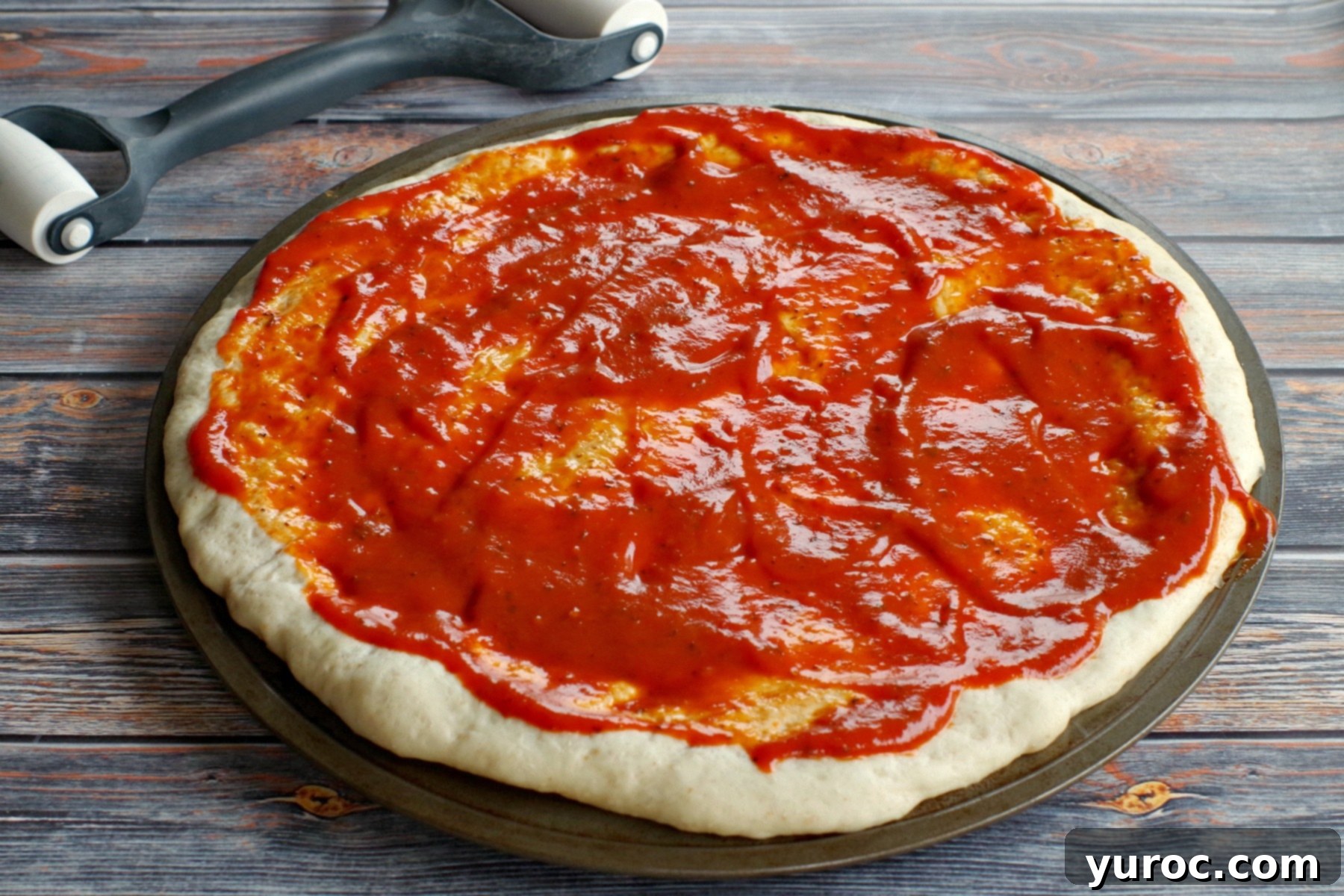 pizza dough with sauce