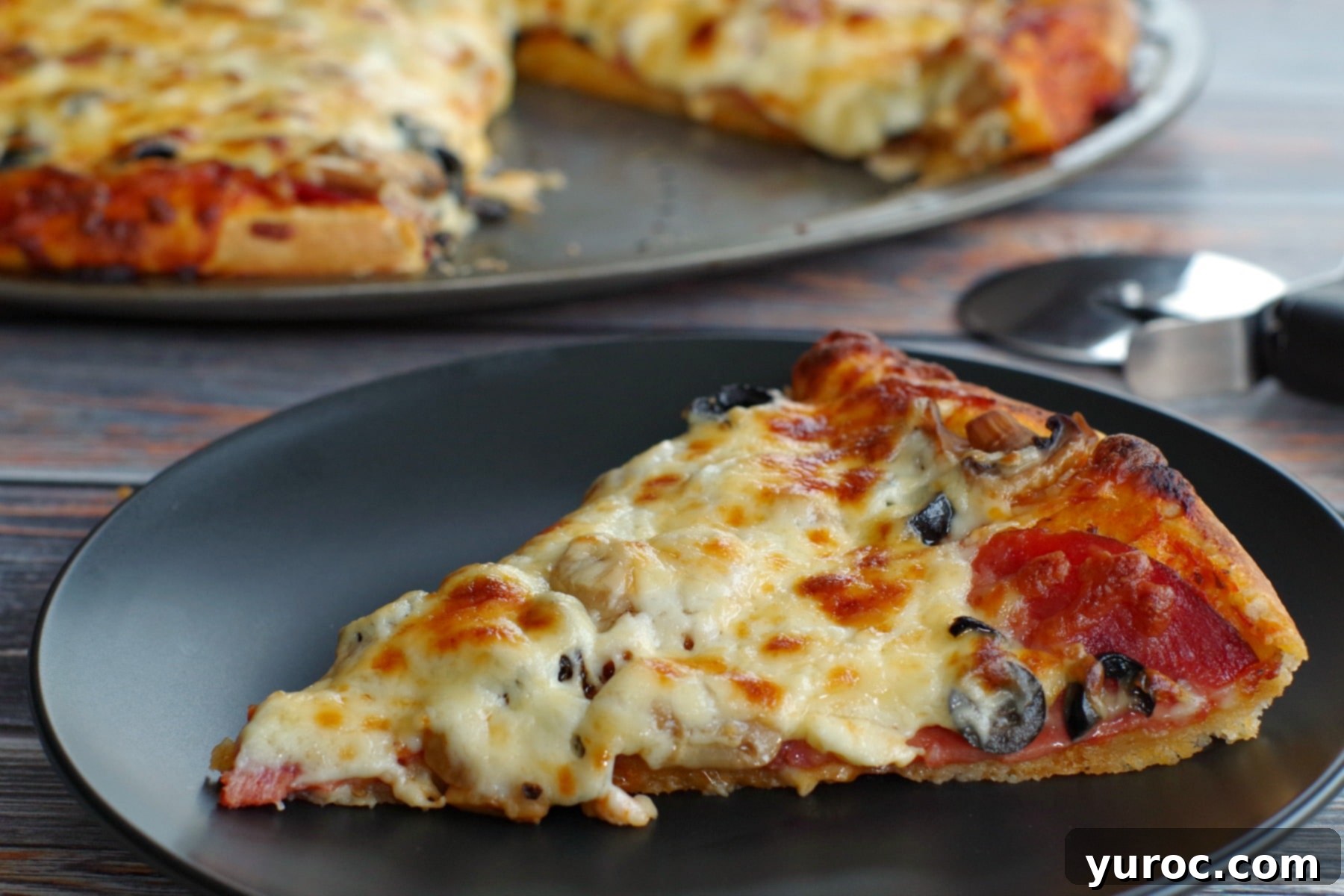 piece of pizza made with bread machine pizza dough