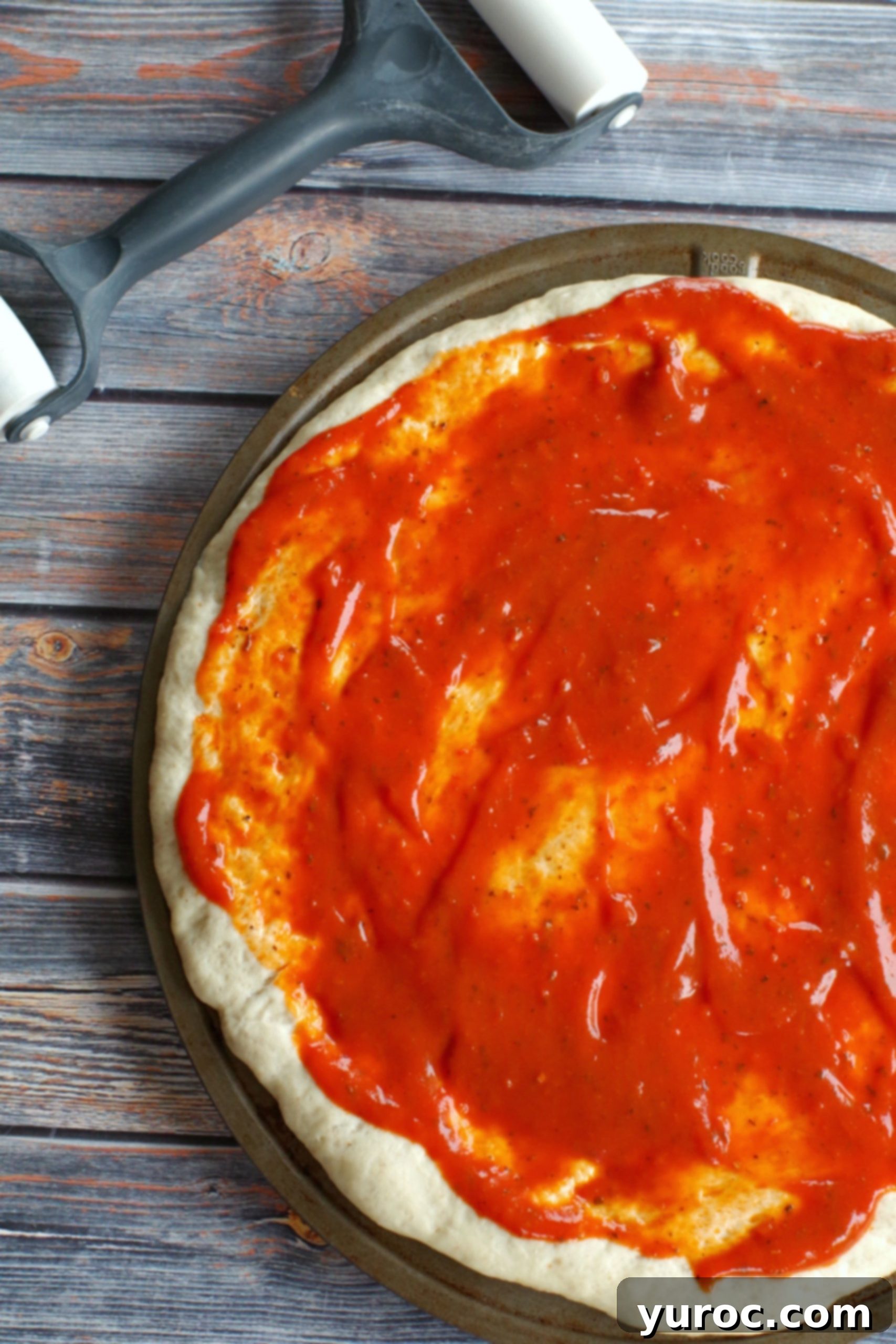pizza dough with sauce