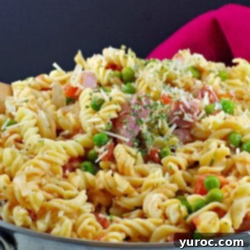 ham pasta in a pot with red napkin in the background