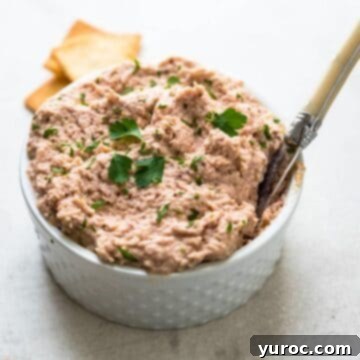 homemade deviled ham in a white dish with a spoon