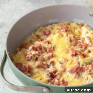 skillet chicken cordon bleu in a green pot with silver handle