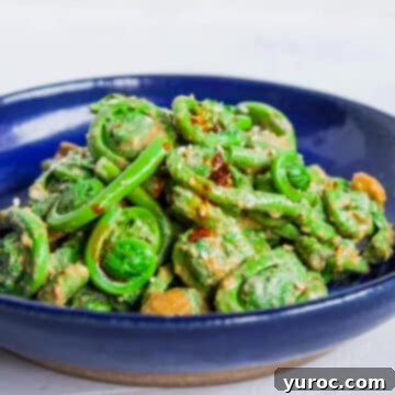 15 Creative Fiddlehead Dishes 17 fiddlehead salad with sesame dressing in a blue bowl