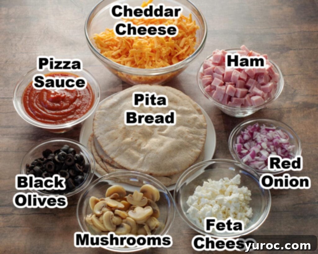 Labelled ingredients neatly arranged for making pita pizzas.