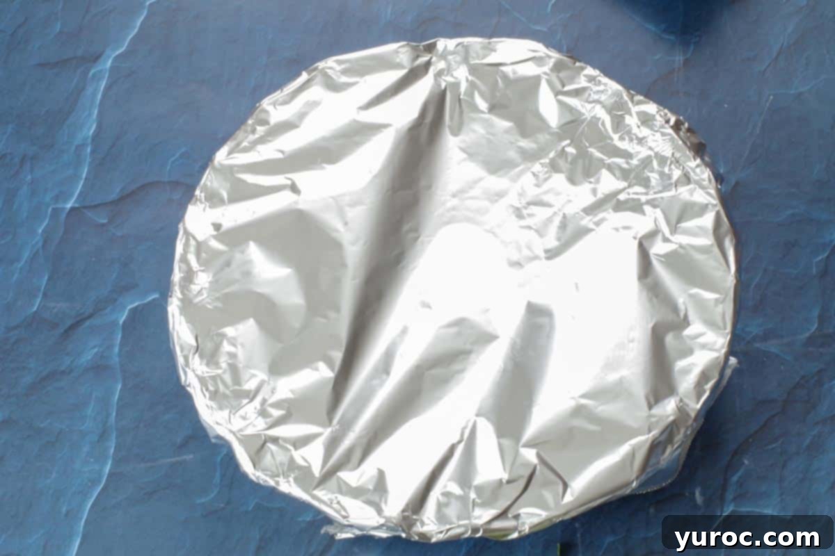 Mediterranean Slim Crustless Quiche 13 quiche in pie dish with foil over top (sealed)