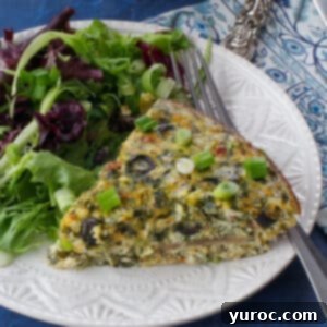 Mediterranean Slim Crustless Quiche 14 slice of ww quiche on a plate with mixed greens