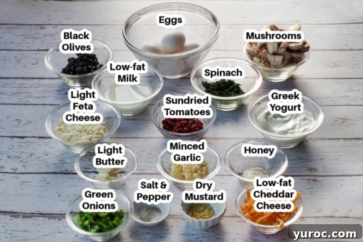 Mediterranean Slim Crustless Quiche 2 Ingredients needed for Mediterranean ww quiche in glass bowls, labelled on a faux white wood surface