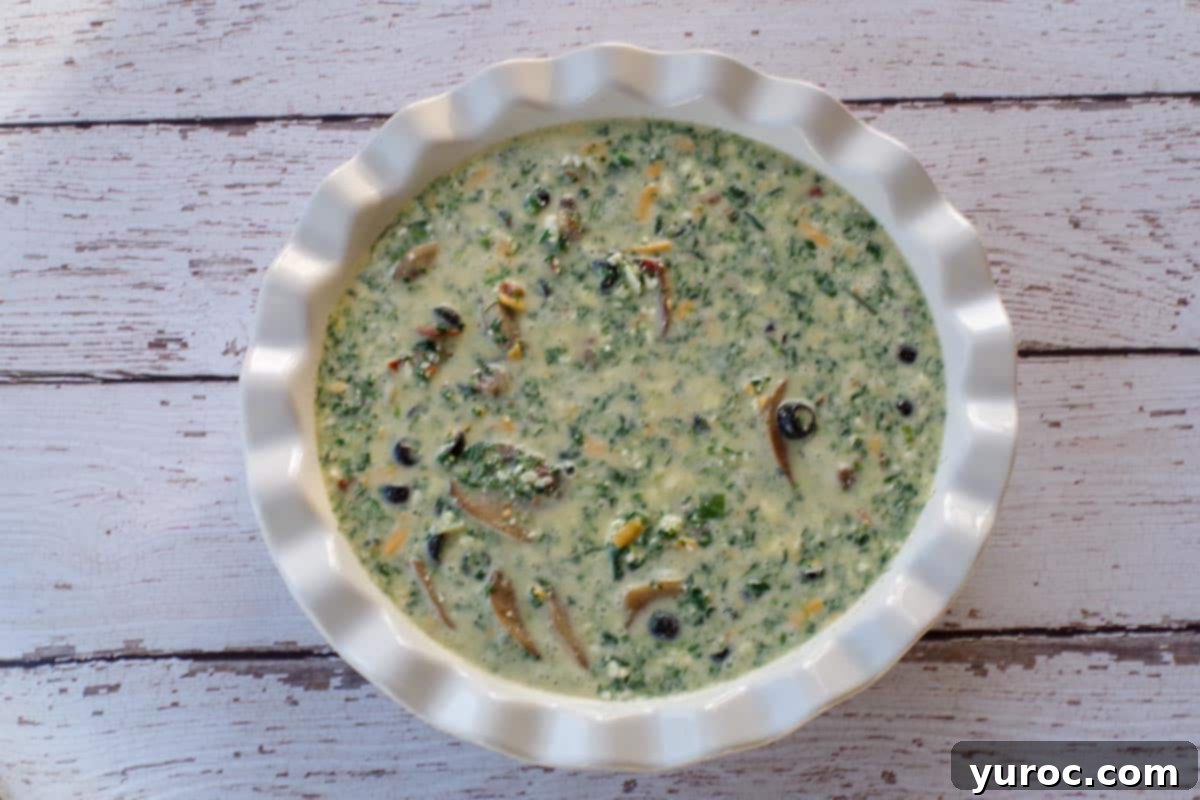 Mediterranean Slim Crustless Quiche 9 quiche filling poured into a pie dish