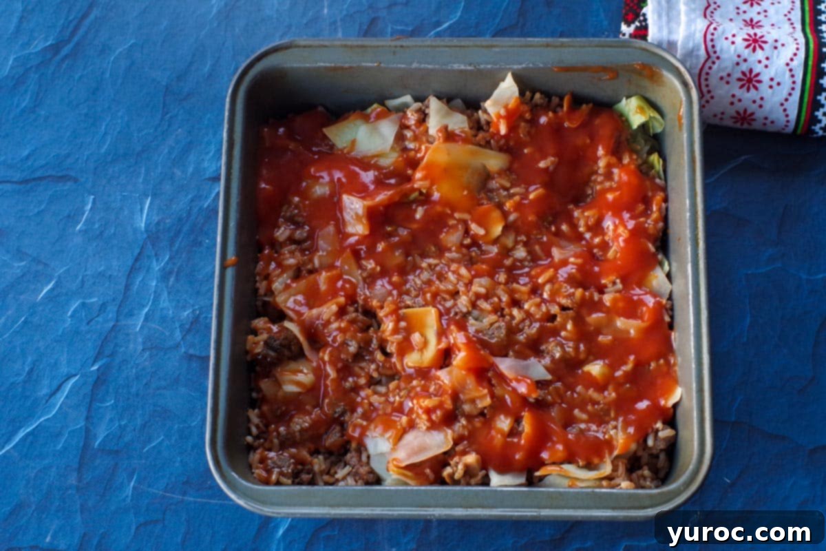leftover cabbage roll filling, leaves and canned tomato soup in an 8X8 pan.