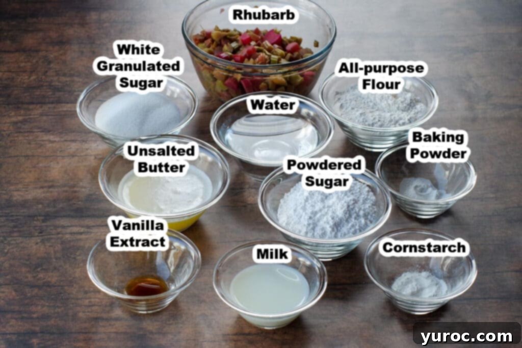A flat lay photograph showcasing all the labeled ingredients meticulously arranged for preparing the sticky rhubarb pudding, highlighting the fresh, vibrant rhubarb alongside other baking staples.