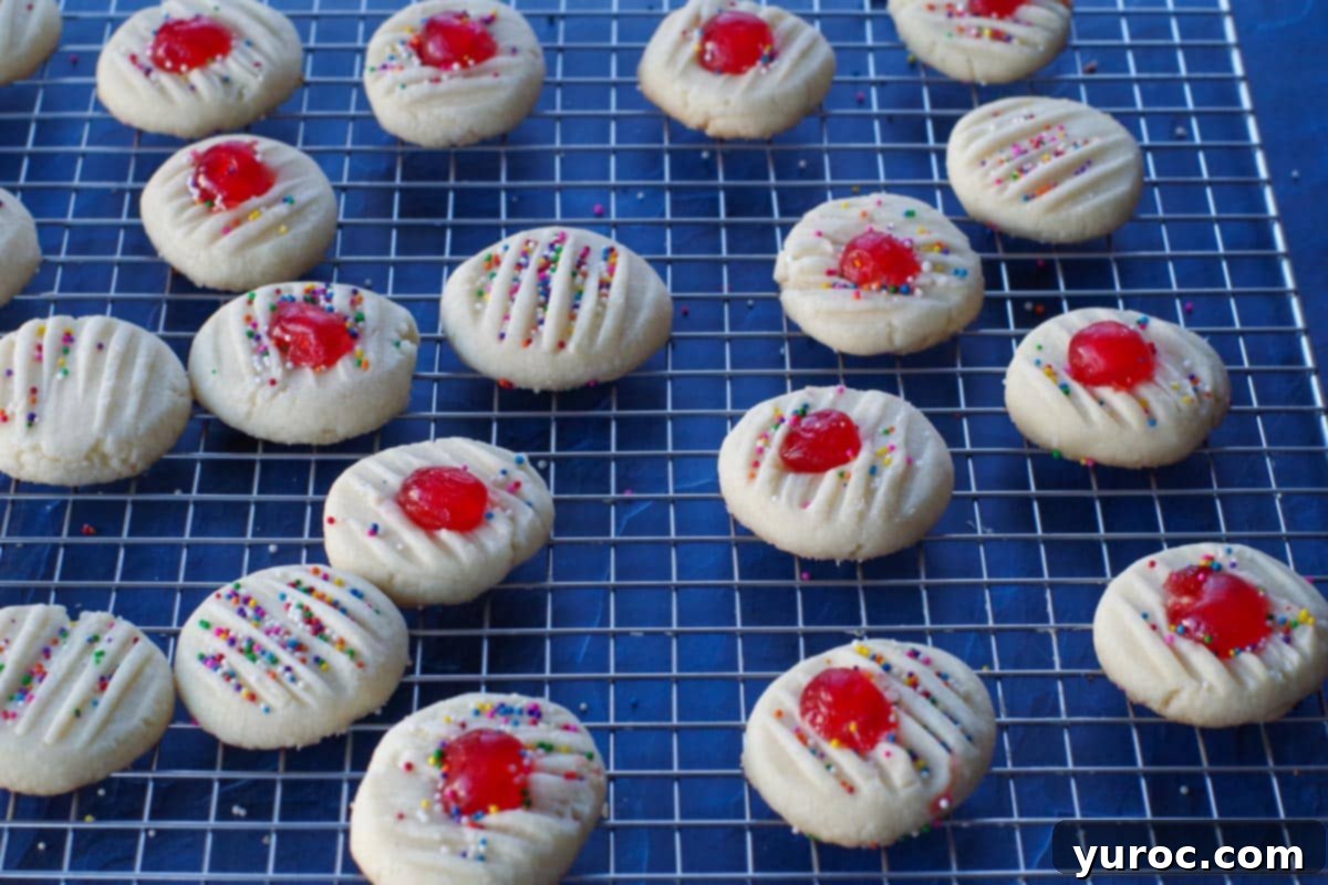baked whipped shortbread with cornstarch on a wire cooling rack