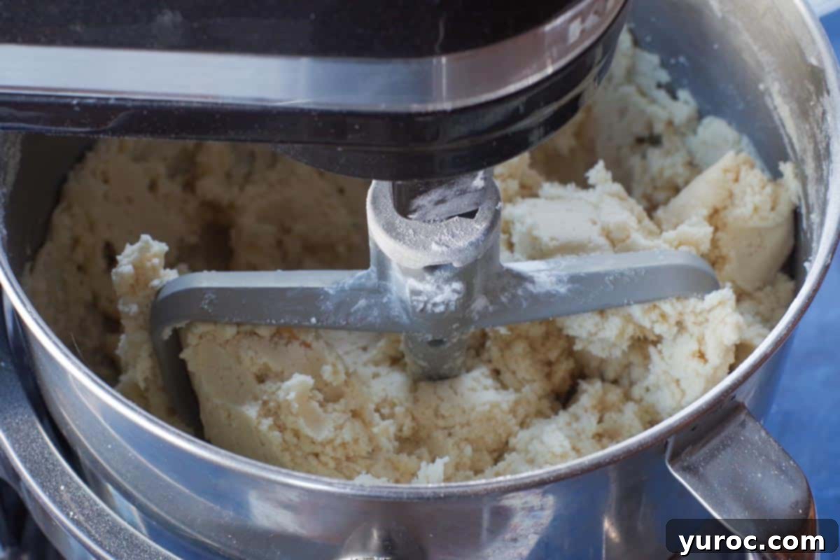 flour and cornstarch added to butter and powdered sugar