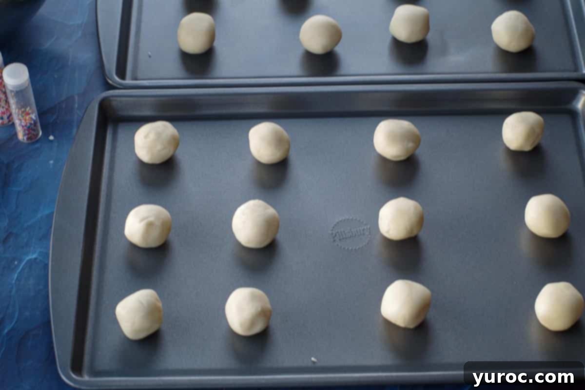 whipped shortbread dough rolled into balls on baking sheets