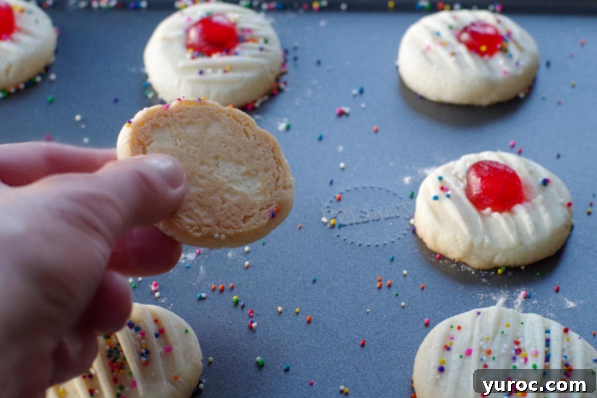 cookie lightly browned on bottom being held up over pan