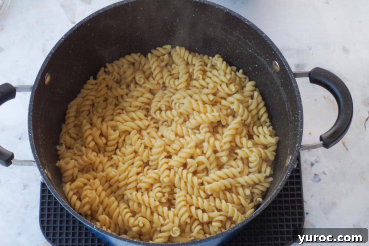 Sun-Kissed Aegean Pasta 6 Pasta cooked al dente and returned to its pot after draining.