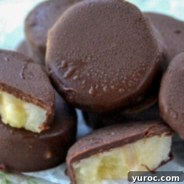 A pile of Copycat Trader Joe's Gone Bananas, with two pieces cut in half to show the frozen banana interior.