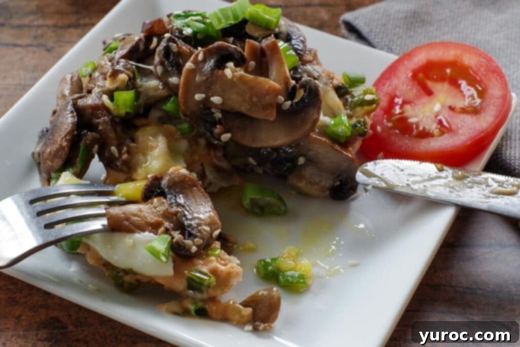 Close-up of sautéed Cremini mushrooms with chopped green onions in a skillet, ready to be added to the breakfast melt.
