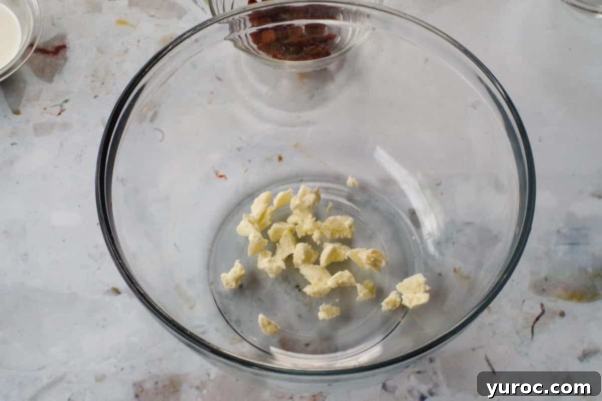butter cut into small pieces in large glass bowl