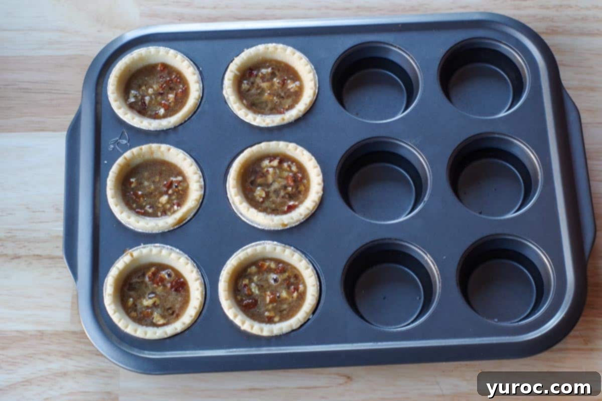 muffins tin filled with ½ tarts and ½ water