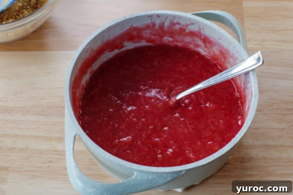 No-Bake Rhubarb Delight 7 rhubarb cooked in pot with spoon