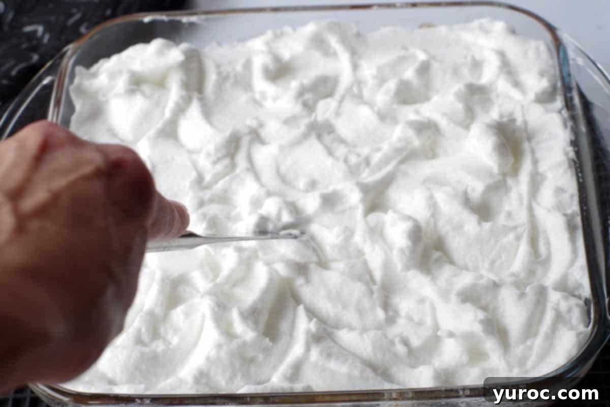 butter knife being used to make little swirls in meringue