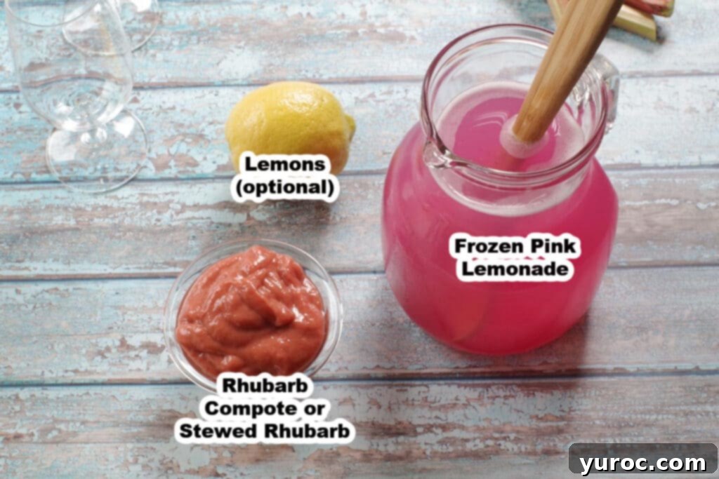 Effortless Rhubarb Lemonade 3 Arrangement of rhubarb lemonade ingredients including frozen pink lemonade concentrate, rhubarb compote in a jar, and fresh lemons, all clearly labeled.