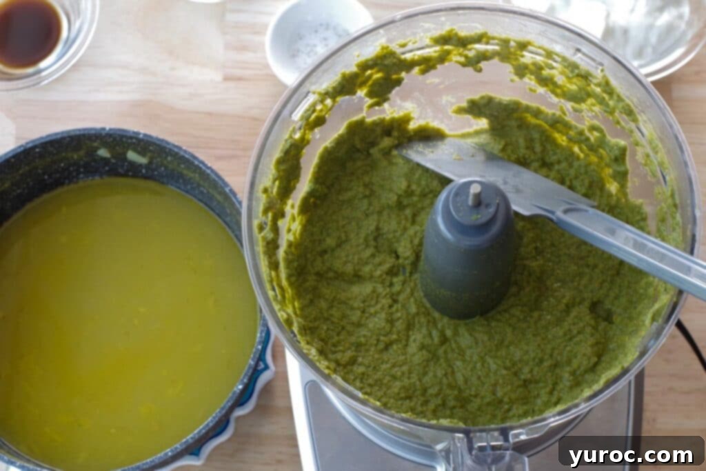Pureed vegetables from the soup in a blender, ready to be returned to the pot.