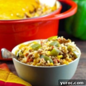 bowl of ww stuffed green pepper casserole in front of a orange casserole dish in background